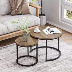 Set of 2 wooden nesting tables with round tops and metal circle frames by arbaana, showcasing modern, versatile accent furniture.