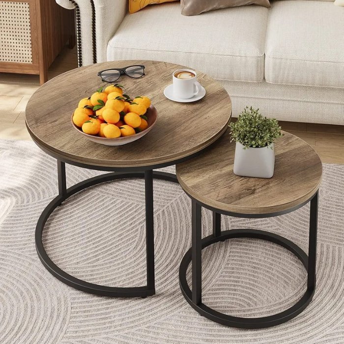 Set of 2 wooden nesting tables with round tops and circle metal frames, stylish and versatile for modern home decor.