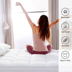 Arbaana cotton quilted mattress topper pad with flexible straps for added softness and comfort on a bed.